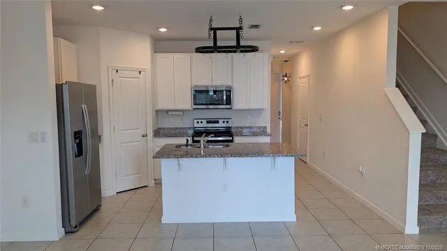 a view of a swimming pool with lounge chair