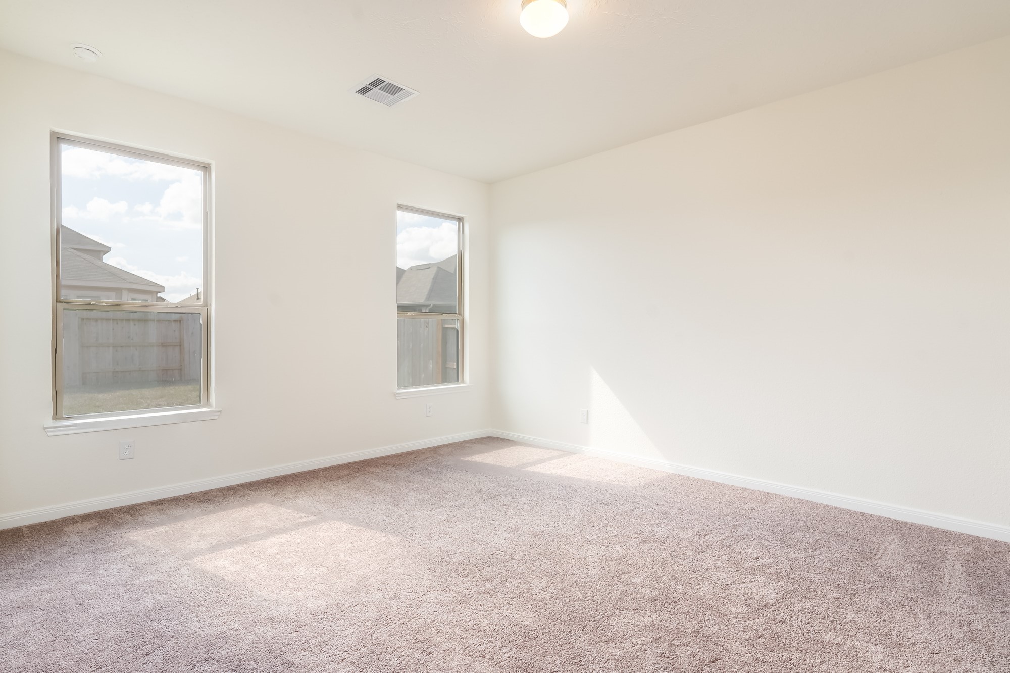 6120 Whitewing Road Rosenberg, TX 77469 - Photo 18 of 35 an empty room with windows