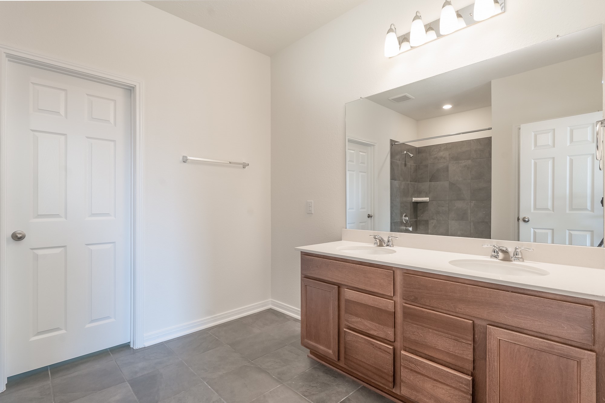6120 Whitewing Road Rosenberg, TX 77469 - Photo 21 of 35 a bathroom with a sink vanity and mirror