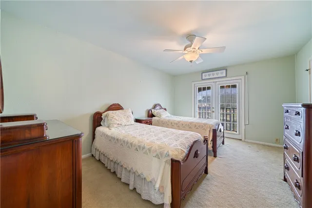 a bed room with a bed and a chandelier