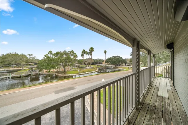 a view of balcony with wooden floor