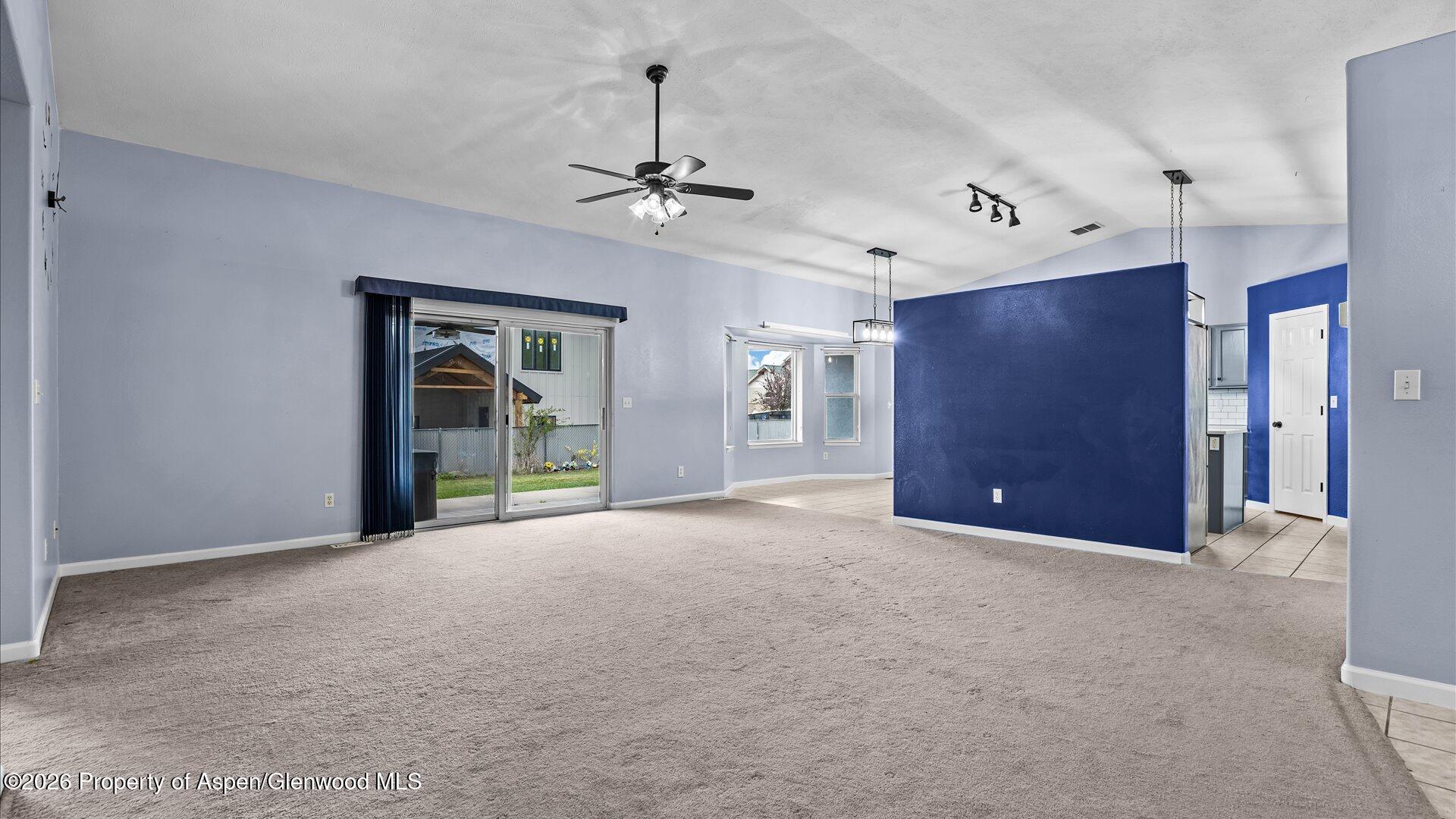 1459 Anvil View Avenue Rifle, CO 81650 - Photo 4 of 29 a view of a livingroom with a ceiling fan and window