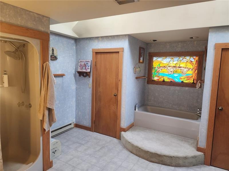 222 Camelot Road Portersville, PA 16051 - Photo 12 of 16 a bathroom with a tub and a shower