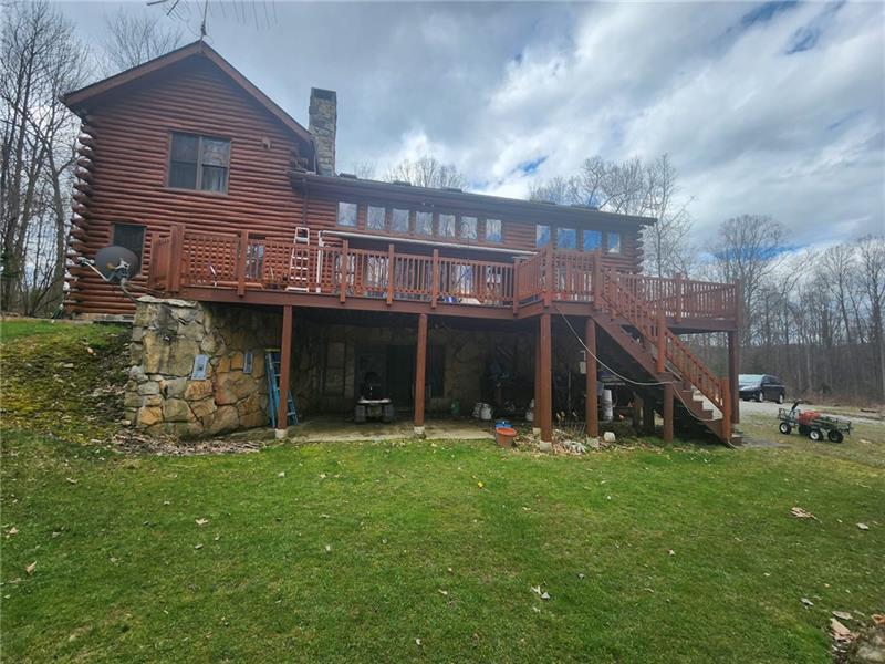 222 Camelot Road Portersville, PA 16051 - Photo 2 of 16 a view of a house with a yard and sitting area