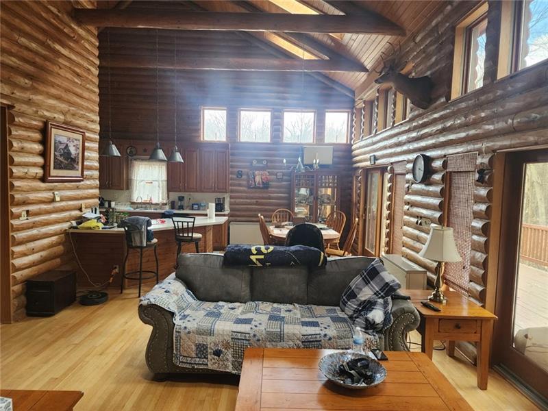 222 Camelot Road Portersville, PA 16051 - Photo 7 of 16 a kitchen with furniture a refrigerator and a view of living room