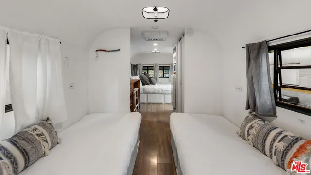 a bedroom with bed and window