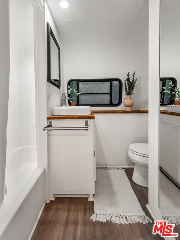 a bathroom with a toilet and a sink