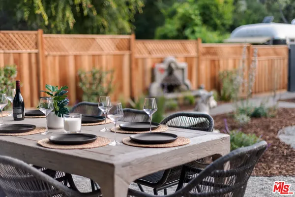 a view of table and chairs in patio