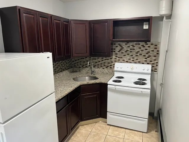 a kitchen with a stove and a microwave