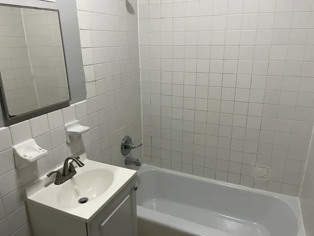 a bathroom with a sink and bathtub