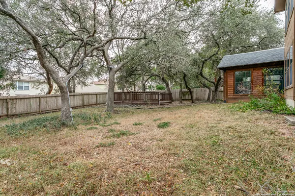 a backyard of a house with lots of green space