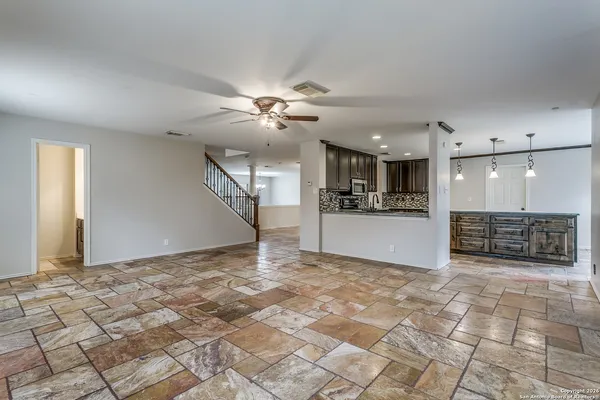 a view of a livingroom with a kitchen
