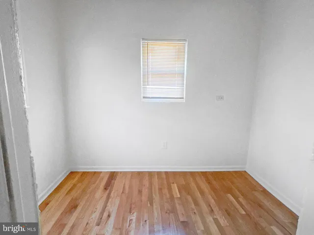a view of a room with wooden floor and small space