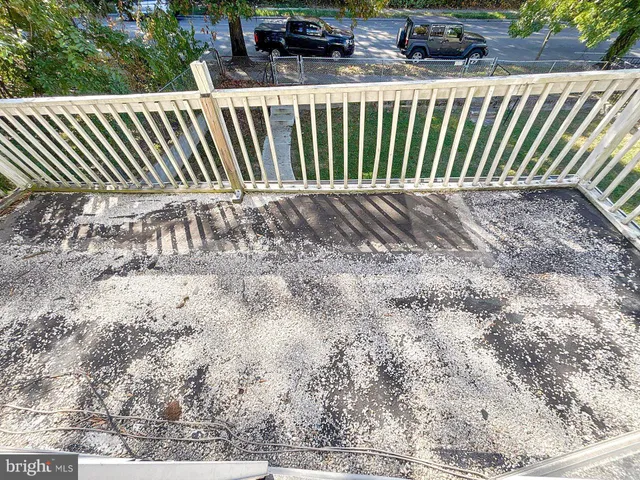 a view of a backyard with a fence