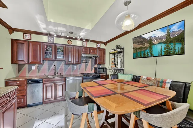 a dinning table and chairs in a kitchen