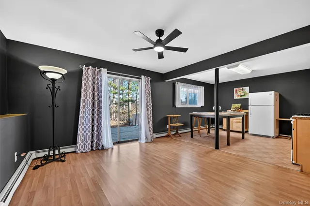 a view of a livingroom with furniture and window