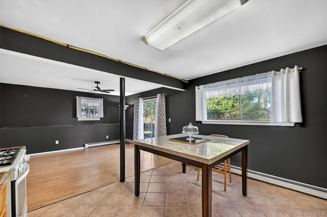 a kitchen with sink microwave and stove