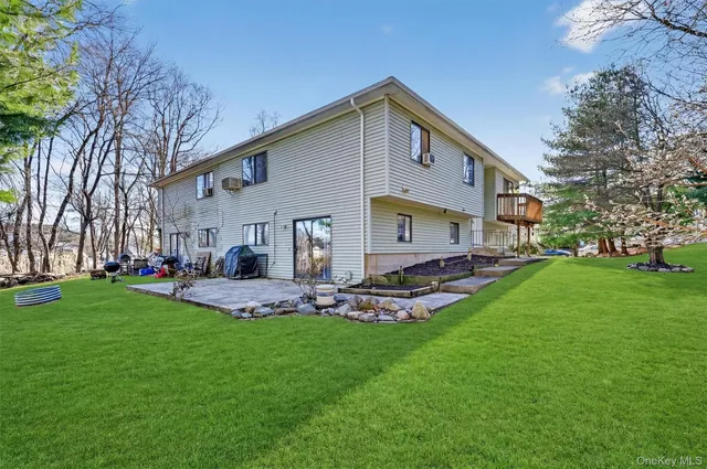 a view of a backyard with large trees