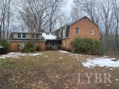 211 Snooty Fox Road Goode, VA 24556 - Photo 1 of 9 a view of a house with a yard and tree s