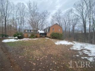 211 Snooty Fox Road Goode, VA 24556 - Photo 2 of 9 a view of a yard with large tree