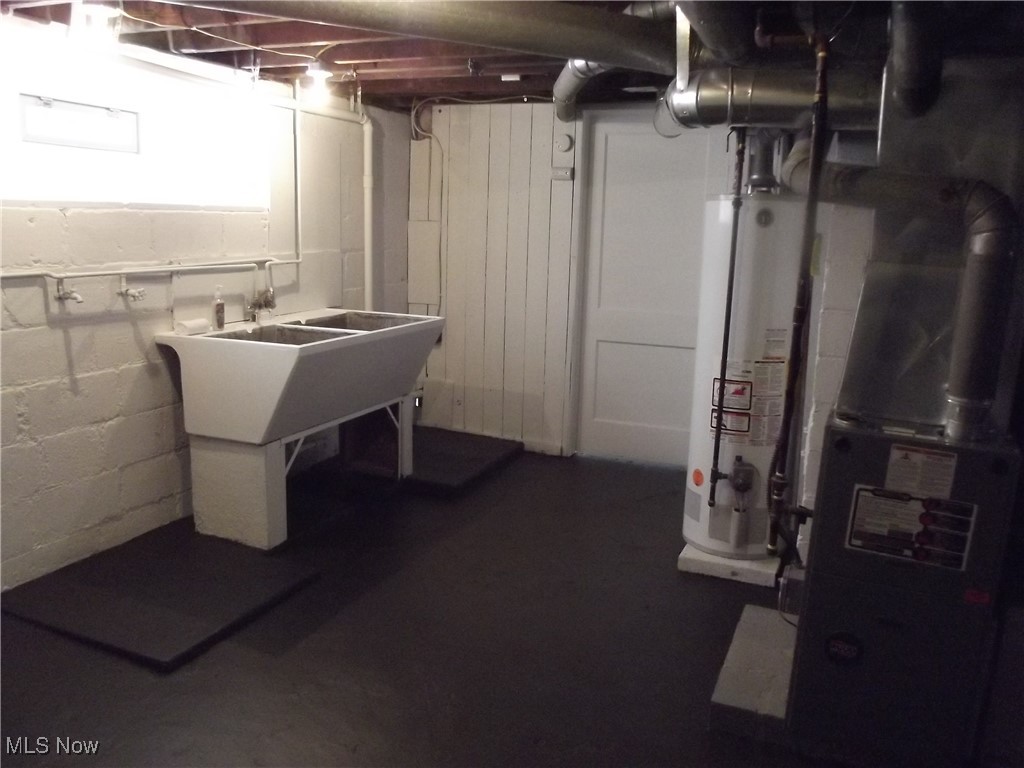 3904 Snow Road Cleveland, OH 44134 - Photo 38 of 50 Basement featuring heating unit and gas water heater