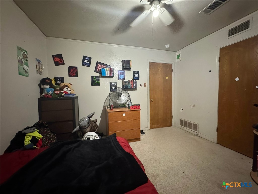 3221 West Ave R Temple, TX 76504 - Photo 23 of 48 a bedroom with a bed and cabinets