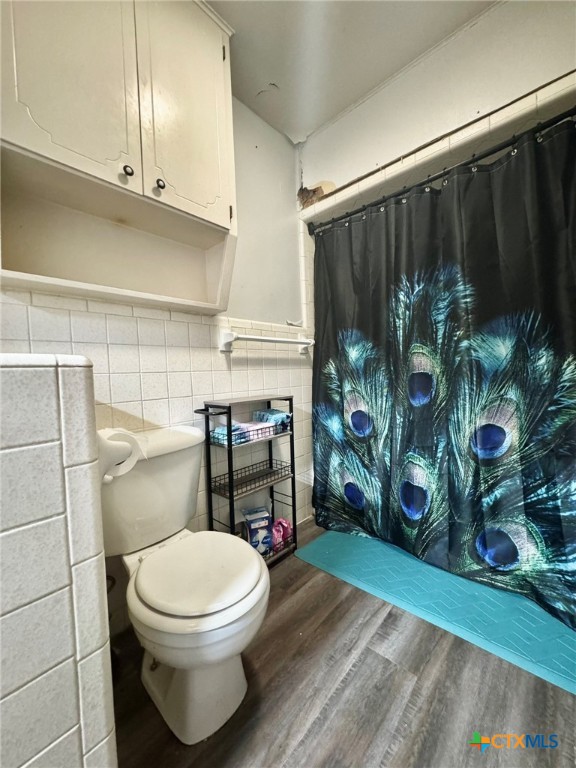 3221 West Ave R Temple, TX 76504 - Photo 24 of 48 a bathroom with a toilet and shower