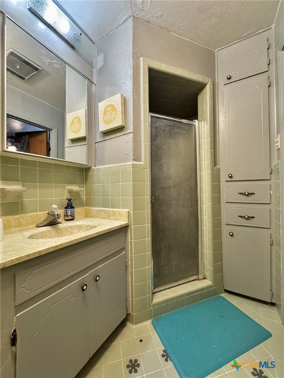 3221 West Ave R Temple, TX 76504 - Photo 28 of 48 a bathroom with a sink and a mirror