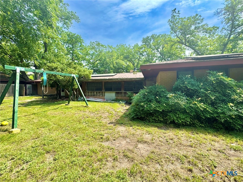 3221 West Ave R Temple, TX 76504 - Photo 35 of 48 a view of a backyard with a garden and plants