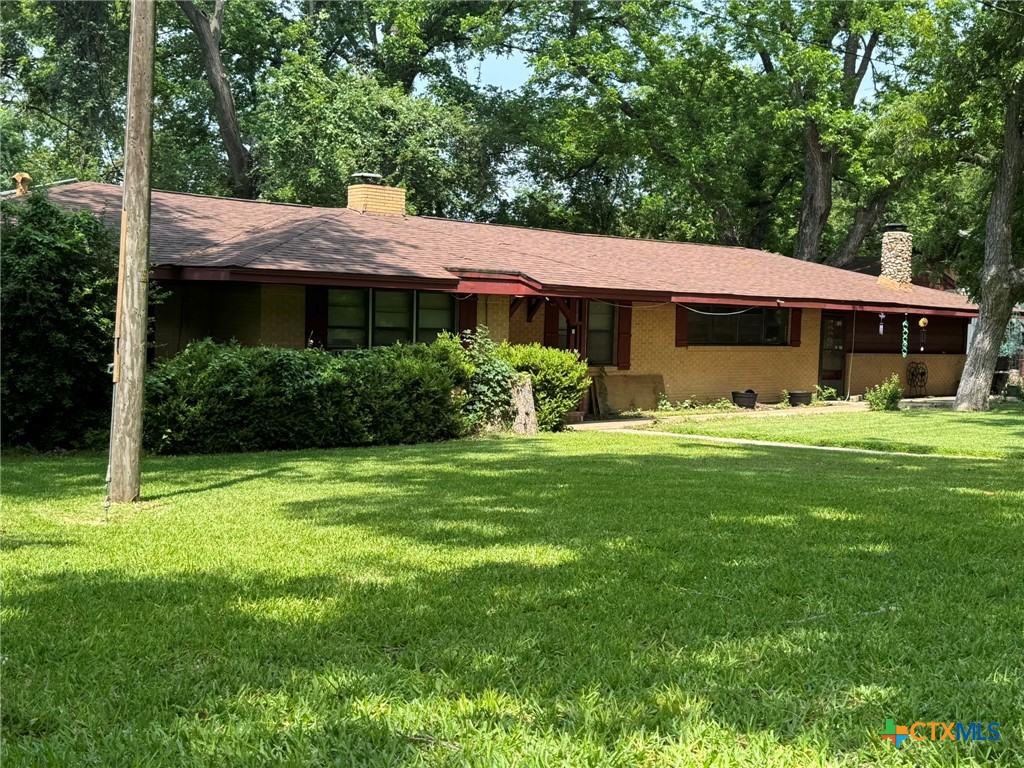 3221 West Ave R Temple, TX 76504 - Photo 4 of 48 a view of a house with a yard
