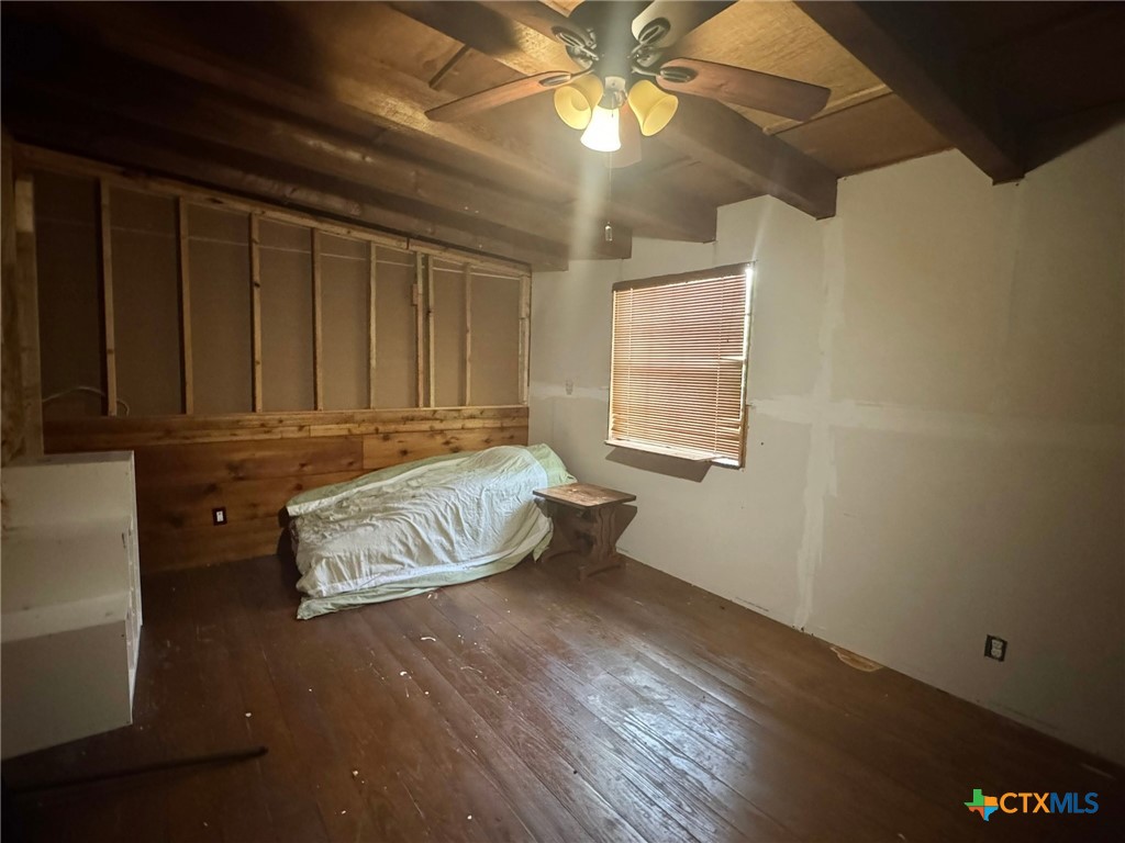 3221 West Ave R Temple, TX 76504 - Photo 47 of 48 a bedroom with a bed and wooden floor