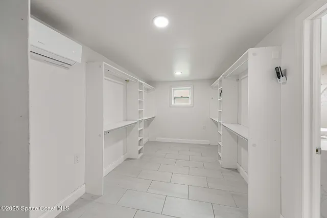 a view of entryway with white walls and white doors