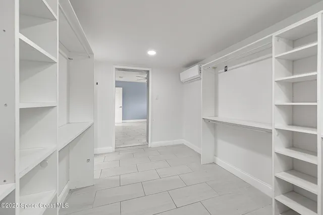 a view of an empty walk in closet