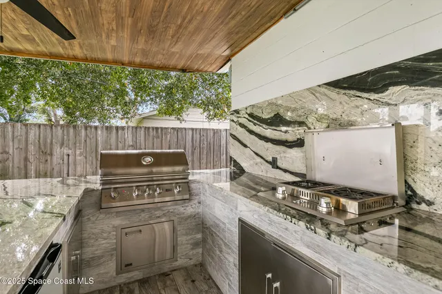 a view of a house with a yard and porch
