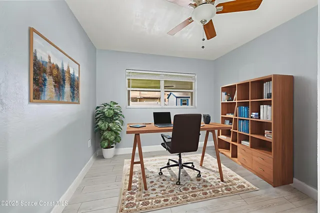 a workspace with furniture window and wooden floor