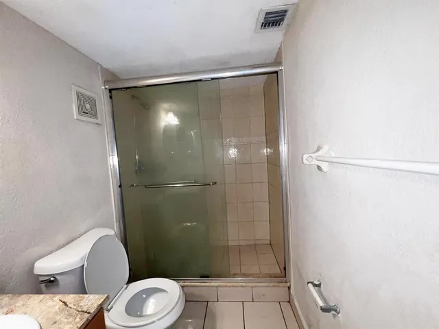 a kitchen that has a sink and a stove