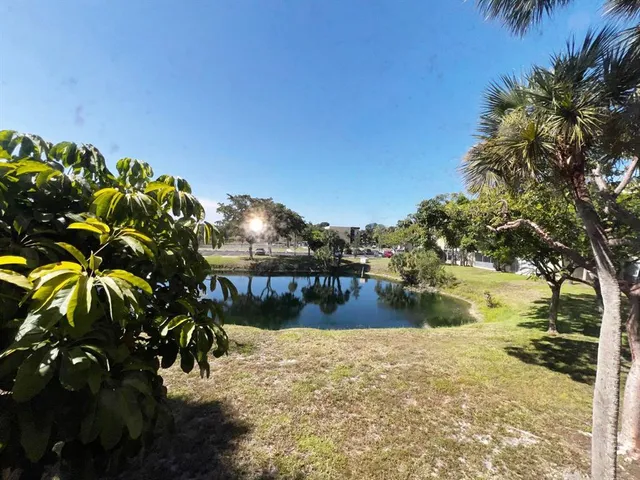 a swimming pool with chairs