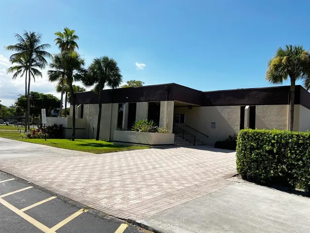a view of a backyard with potted plants