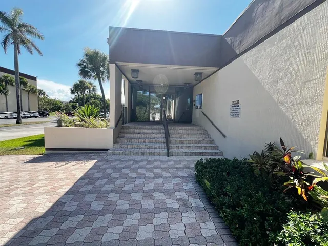 a view of swimming pool with small garden