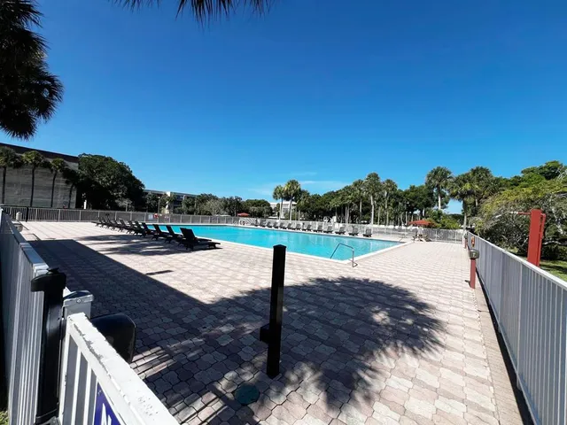 a view of swimming pool with seating space