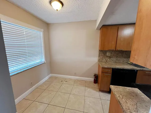 a view of a park with swings and slides