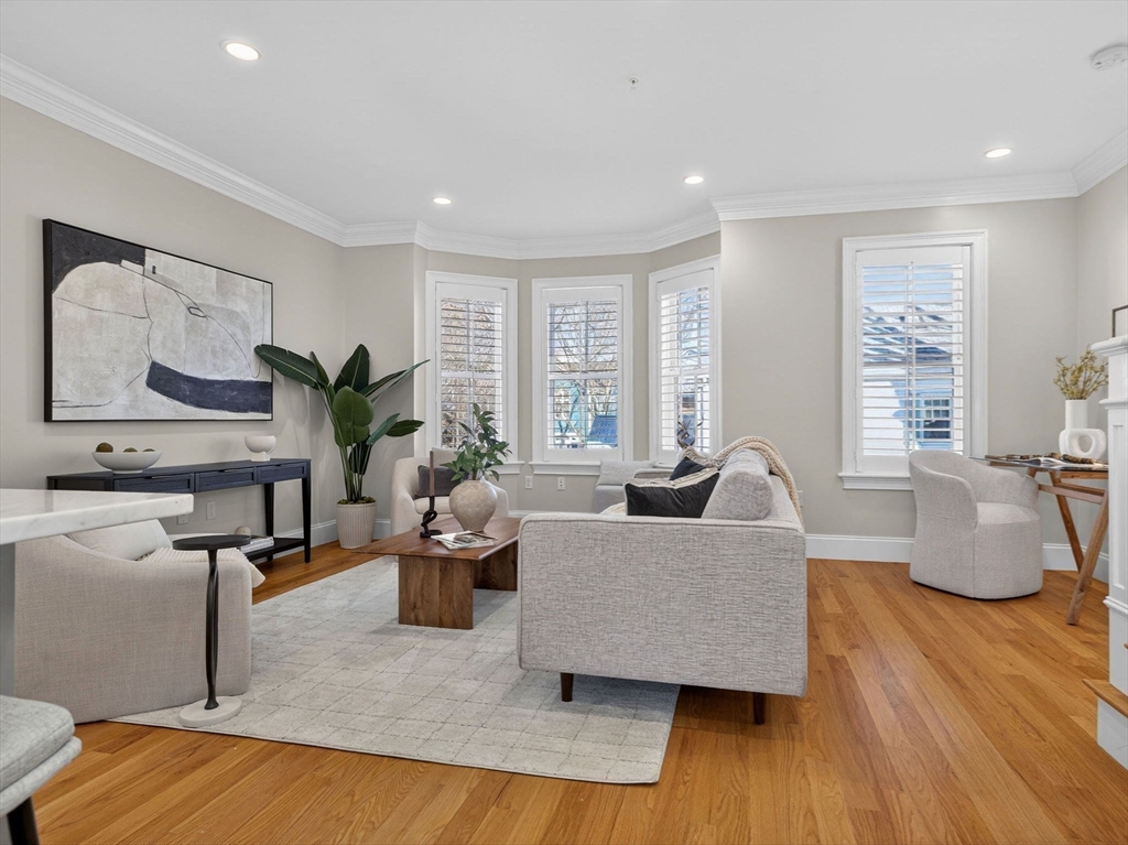 213 Lamartine Street, Unit 213A Boston, MA 02130 - Photo 13 of 39 a living room with furniture and wooden floor