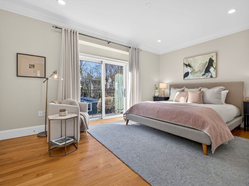 213 Lamartine Street, Unit 213A Boston, MA 02130 - Photo 17 of 39 a bedroom with a bed and glass door