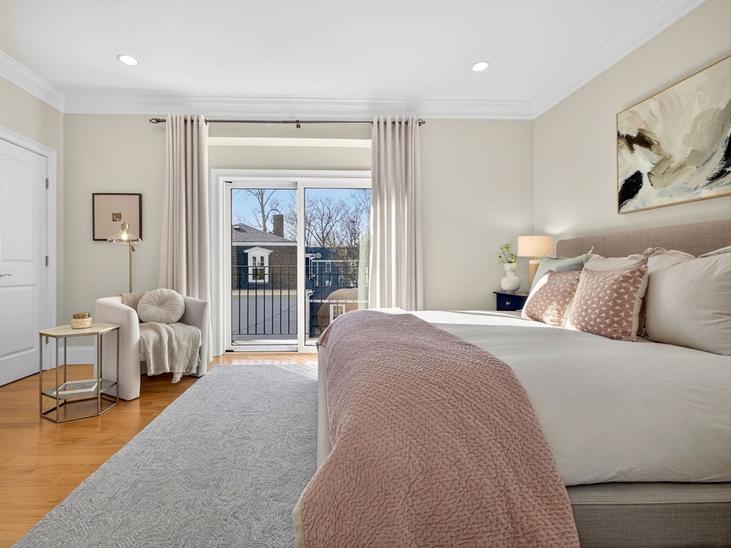 213 Lamartine Street, Unit 213A Boston, MA 02130 - Photo 18 of 39 a bedroom with a large bed and a couch