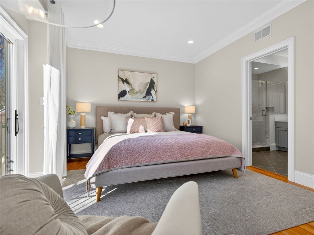 213 Lamartine Street, Unit 213A Boston, MA 02130 - Photo 19 of 39 a bedroom with a bed and a mirror