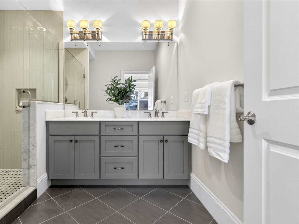 213 Lamartine Street, Unit 213A Boston, MA 02130 - Photo 21 of 39 a bathroom with a double vanity sink mirror and
