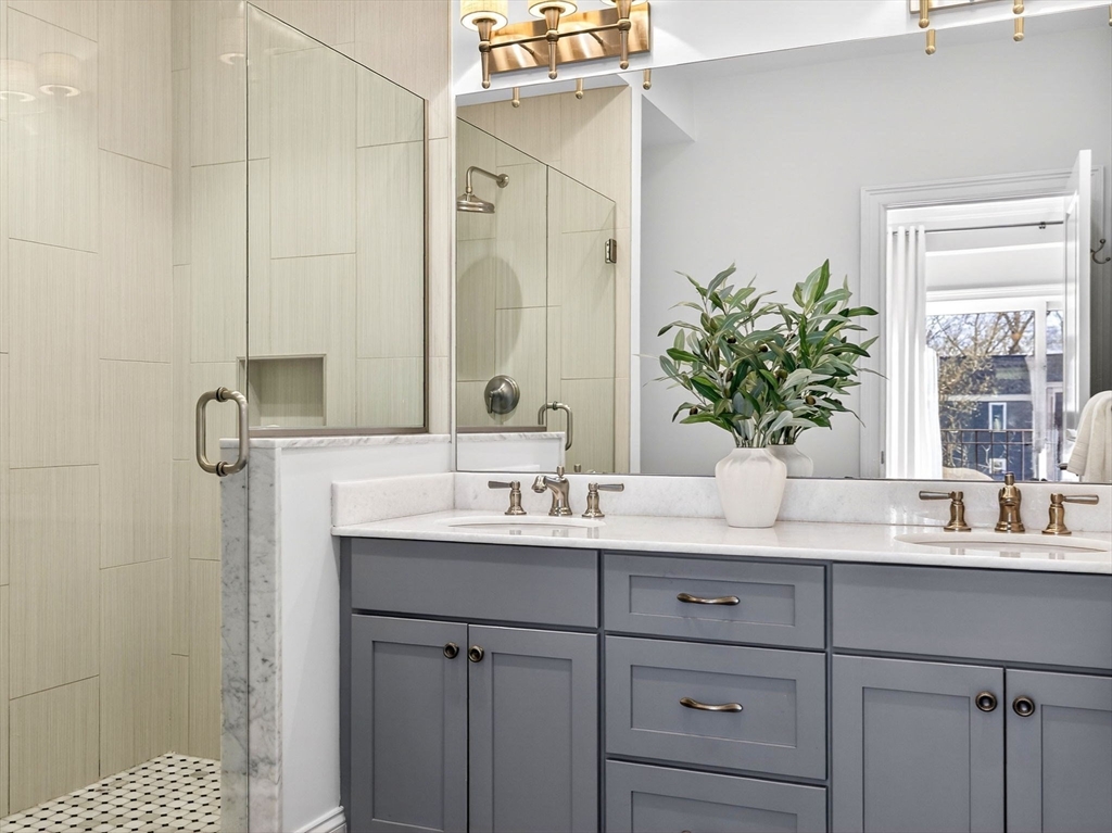 213 Lamartine Street, Unit 213A Boston, MA 02130 - Photo 22 of 39 a bathroom with a sink double vanity and a mirror