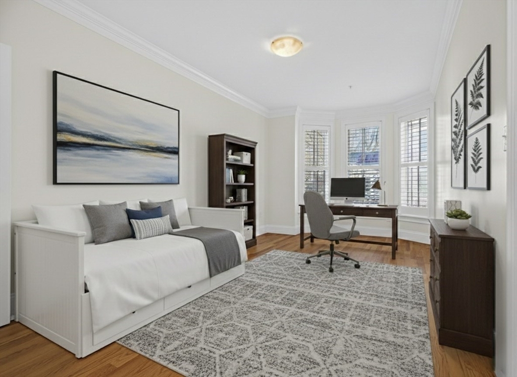 213 Lamartine Street, Unit 213A Boston, MA 02130 - Photo 27 of 39 a living room with furniture and a potted plant