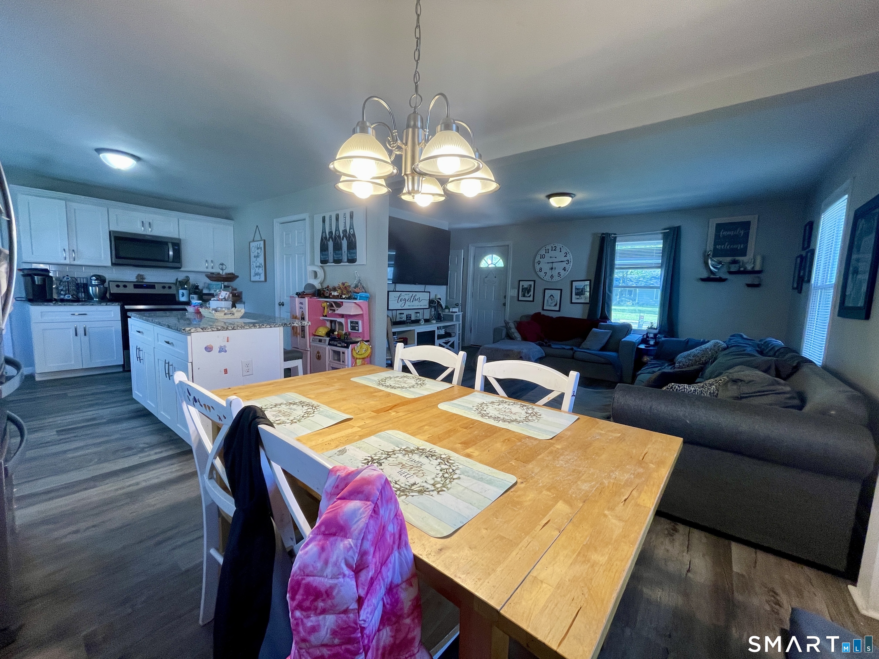 16 Brainard Road Enfield, CT 06082 - Photo 12 of 32 a view of a dining room with furniture and wooden floor