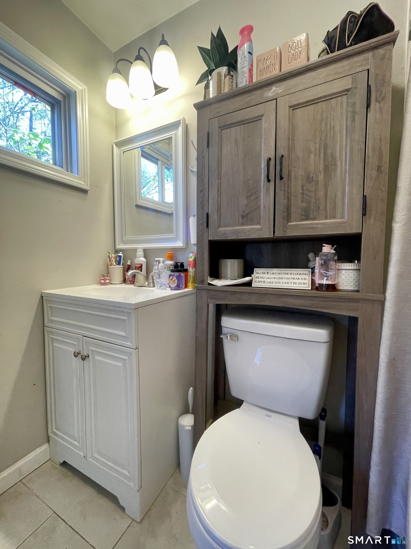 16 Brainard Road Enfield, CT 06082 - Photo 13 of 32 a white toilet sitting next to a bathroom sink